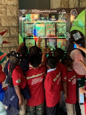 students at bufsci elementary school interact with Morgan's Marvelous STEM Vending Machine