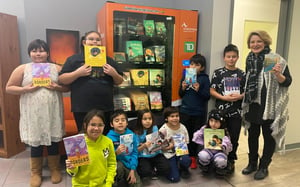 Prince Albert Indian and Métis Friendship Centre Students show off book vending machine