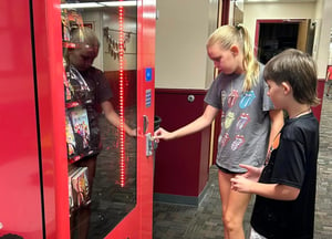 Students with Teammates Branded Book Vending Machine